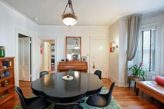 a living room with furniture a rug and a chandelier