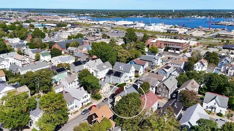 an aerial view of residential houses with outdoor space