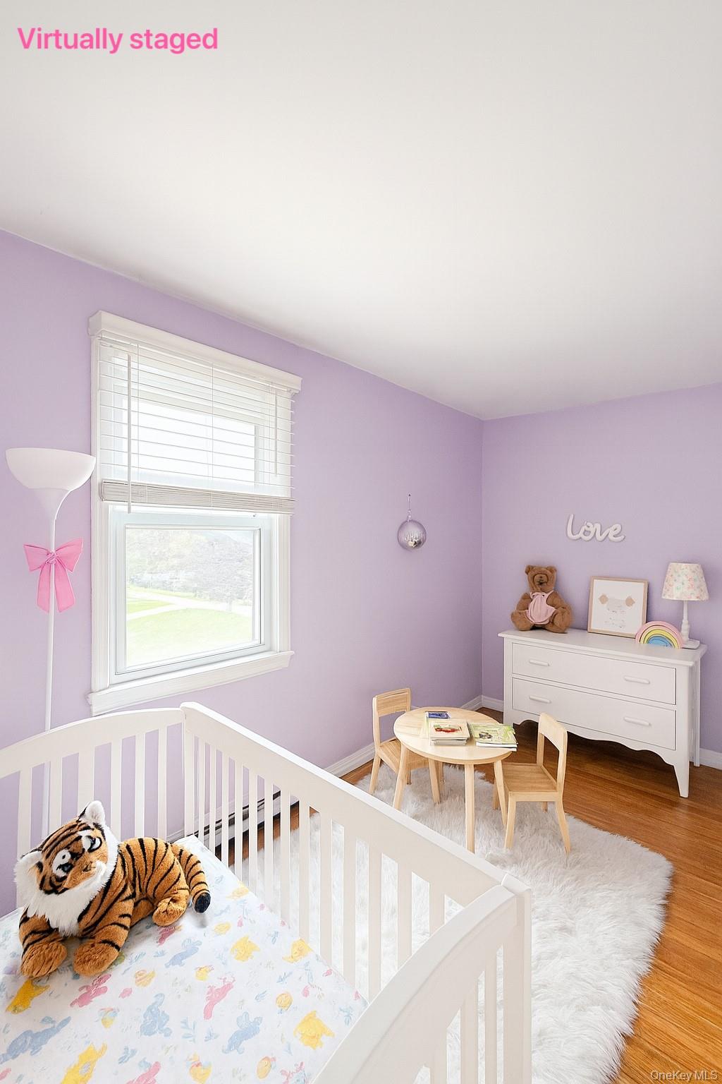 7103 252nd Street, Unit 199B Queens, NY 11426 - Photo 3 of 11 Bedroom with wood finished floors