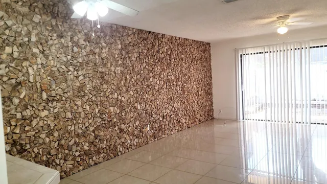 a view of a backyard with wooden fence