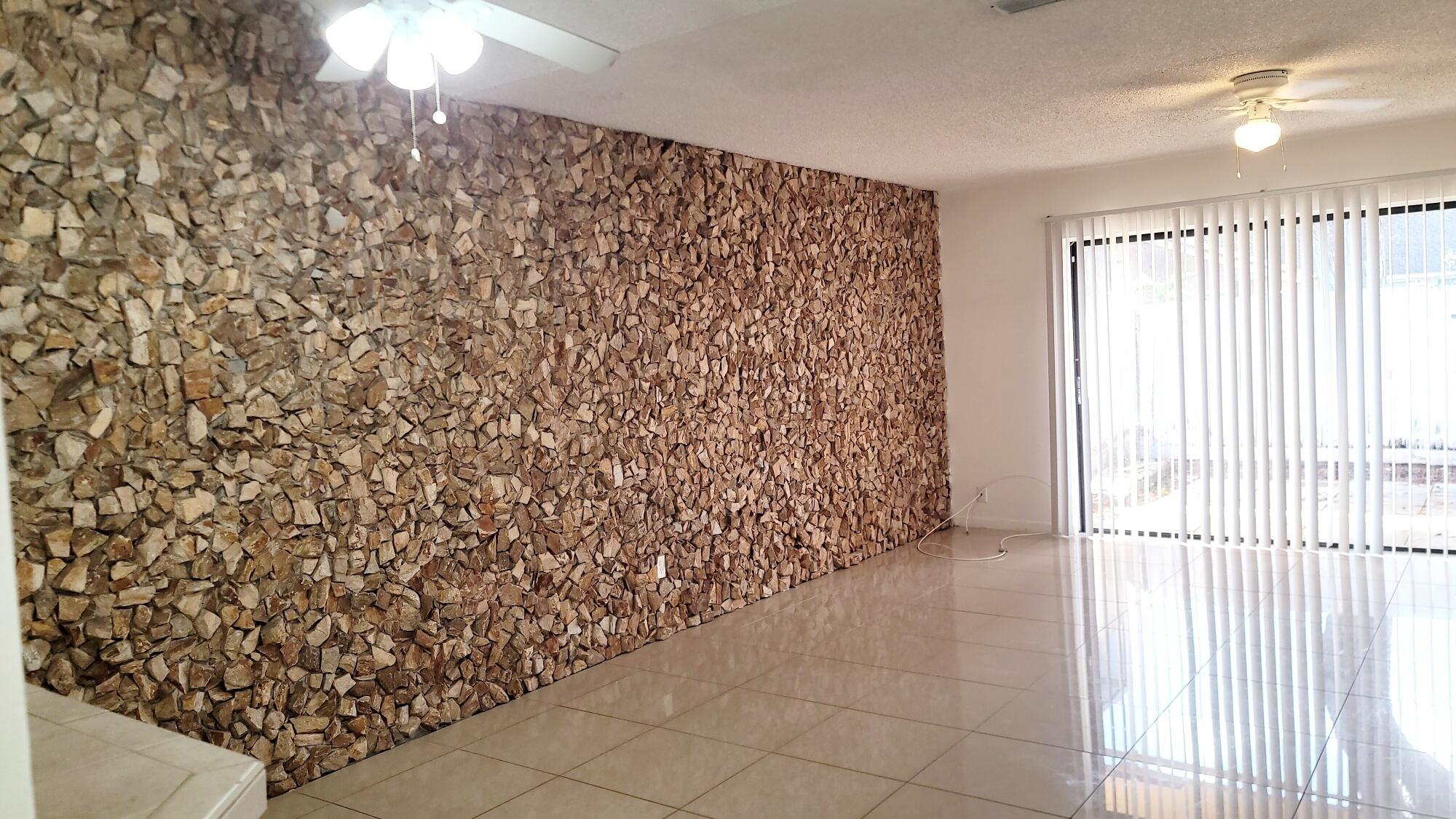 4049 Southwest 68th Way, Unit 6I Miramar, FL 33023 - Photo 16 of 32 wooden floor in an empty room with a window