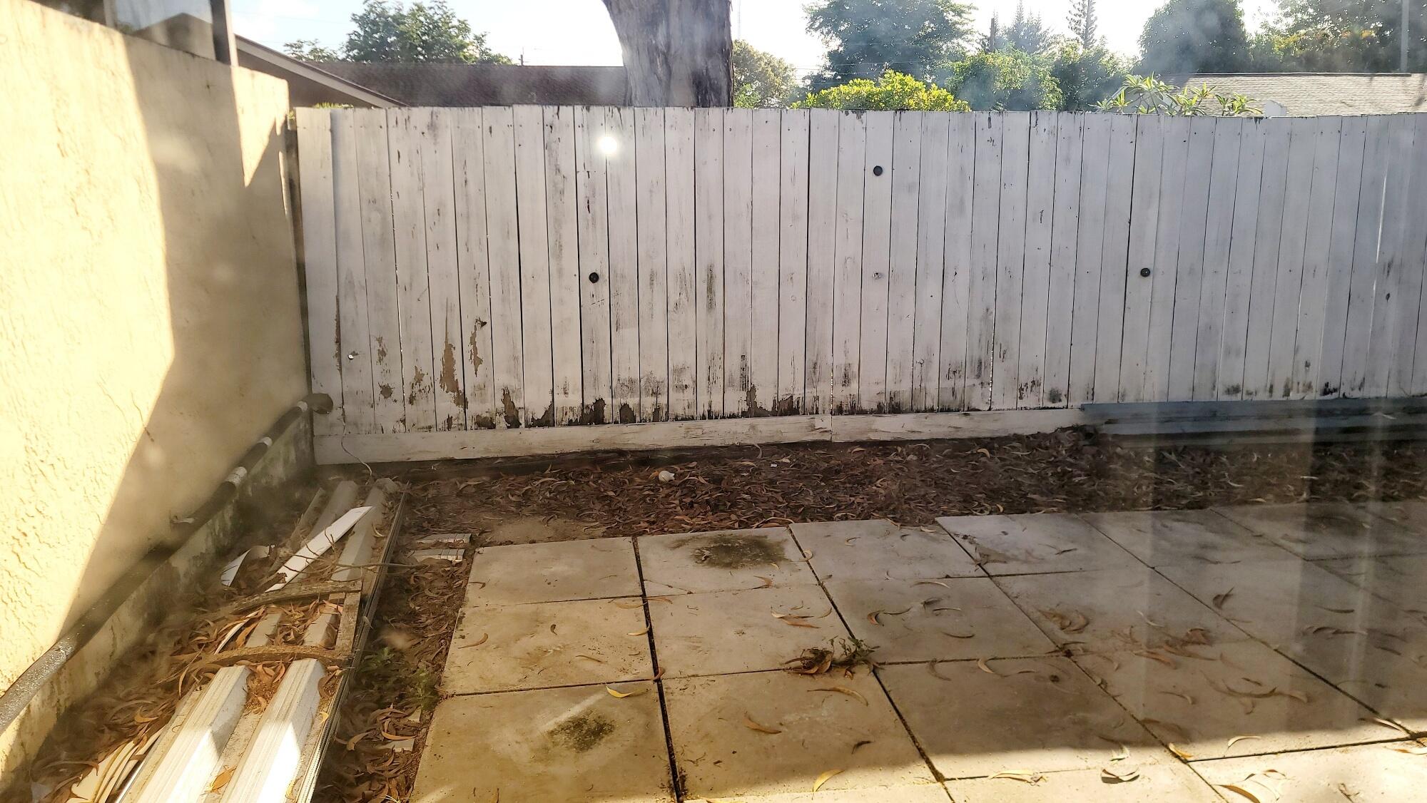 4049 Southwest 68th Way, Unit 6I Miramar, FL 33023 - Photo 18 of 32 a view of a wooden fence