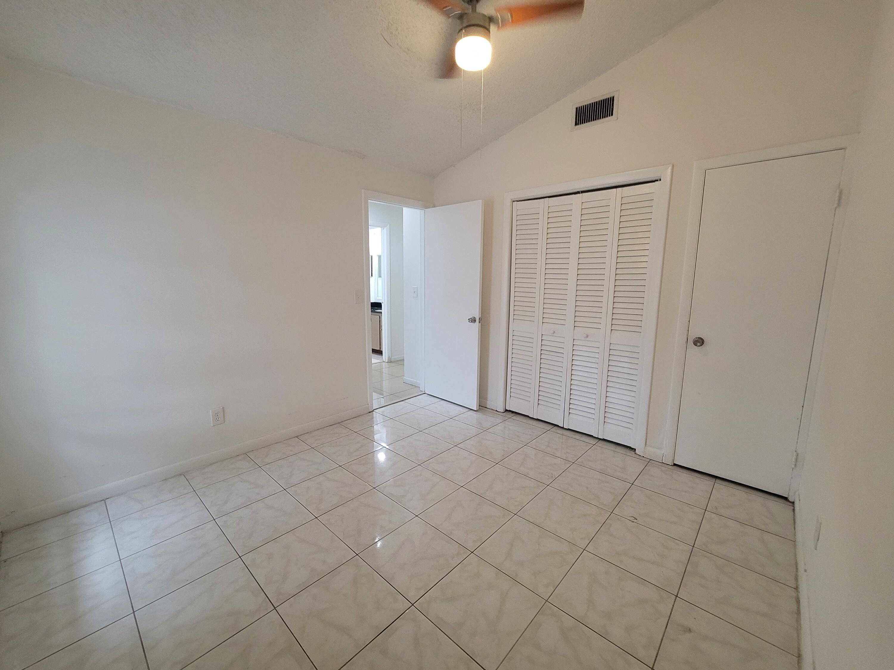 4049 Southwest 68th Way, Unit 6I Miramar, FL 33023 - Photo 23 of 32 an empty room with fan