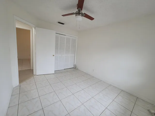 a view of a park that has large trees