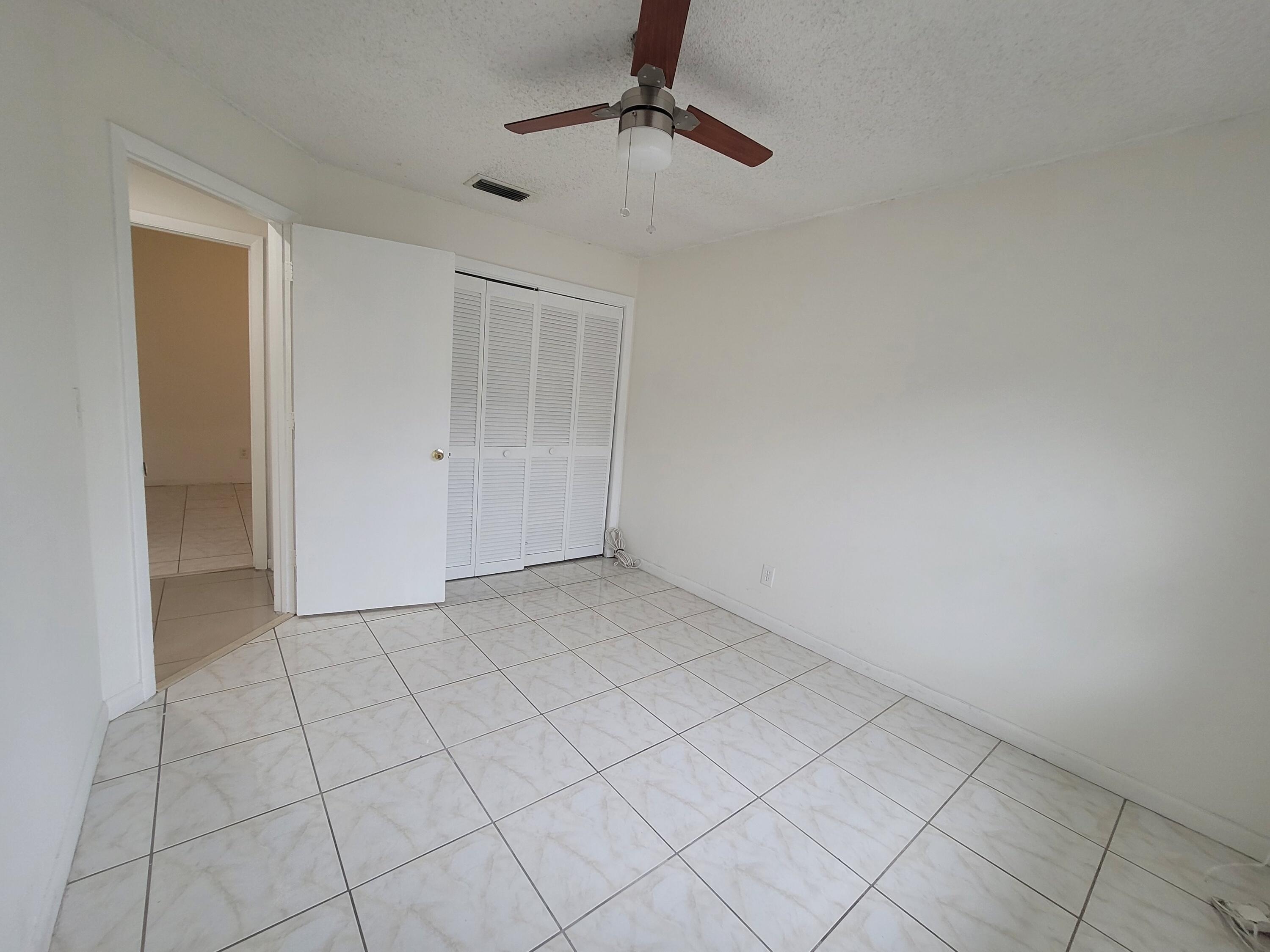 4049 Southwest 68th Way, Unit 6I Miramar, FL 33023 - Photo 27 of 32 an empty room with windows