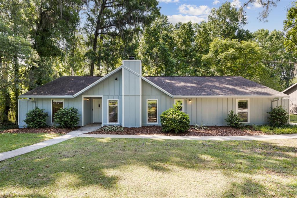 528 Northwest 103rd Terrace Gainesville, FL 32607 - Photo 1 of 1 a front view of house with yard and green space