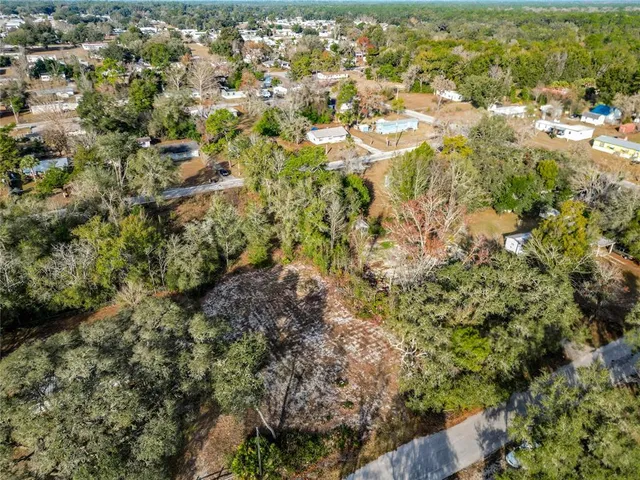 a view of residential houses with yard