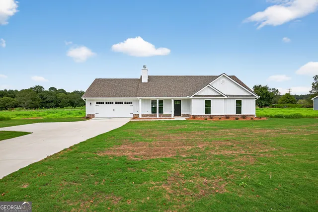 a front view of house with yard and seating area