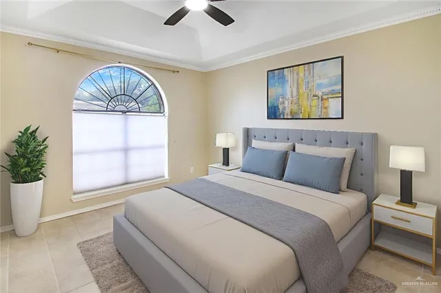 a bedroom with a large bed and a window