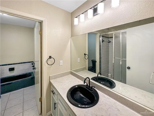 a bathroom with a sink a washer and dryer