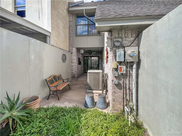 a view of a chairs and table in back of the house