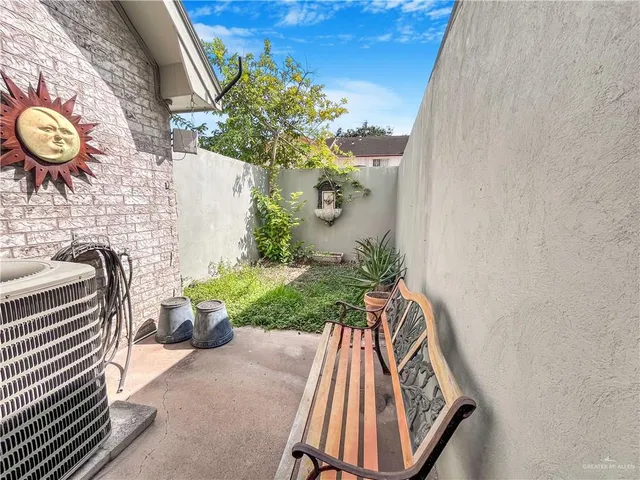 a bathroom with a toilet and a shower curtain