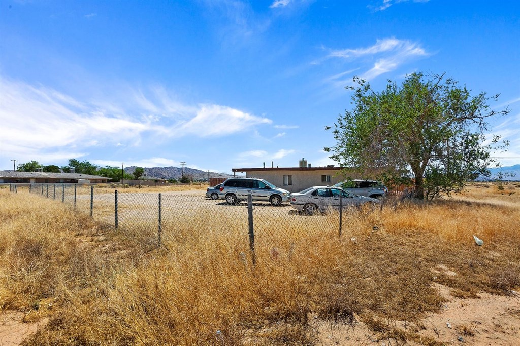 21201 Teepee Road Apple Valley, CA 92307 - Photo 1 of 1 a view of a lake with houses