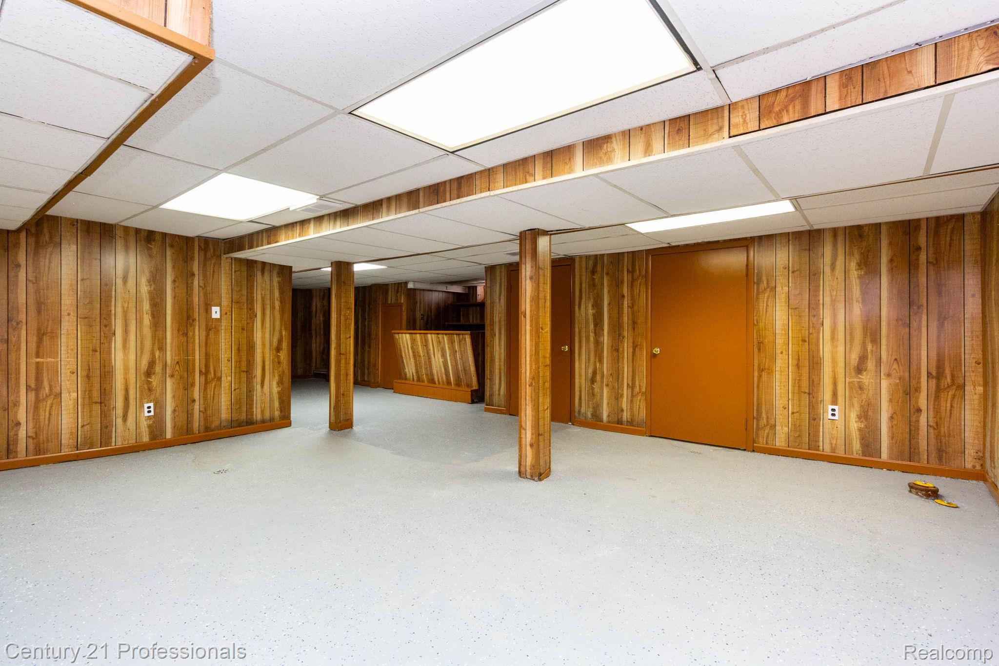 18951 Edinborough Road Detroit, MI 48219 - Photo 23 of 47 Finished below grade area with wooden walls and a paneled ceiling