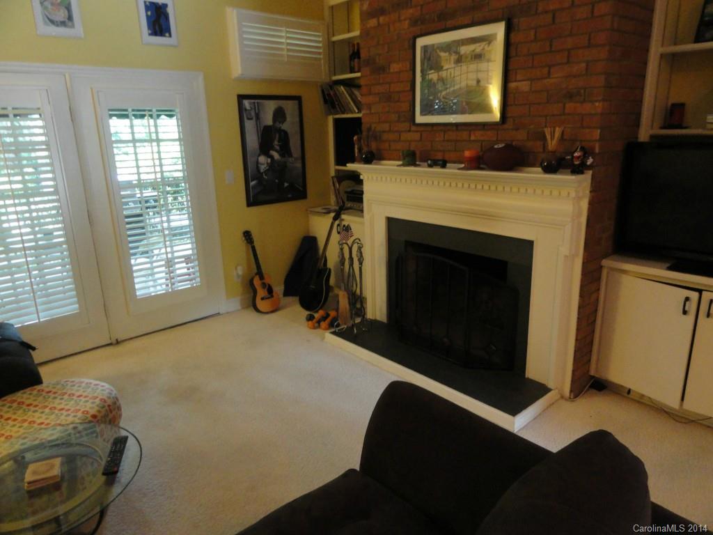 1010 Queens Road Charlotte, NC 28207 - Photo 2 of 4 a living room with furniture and a fireplace
