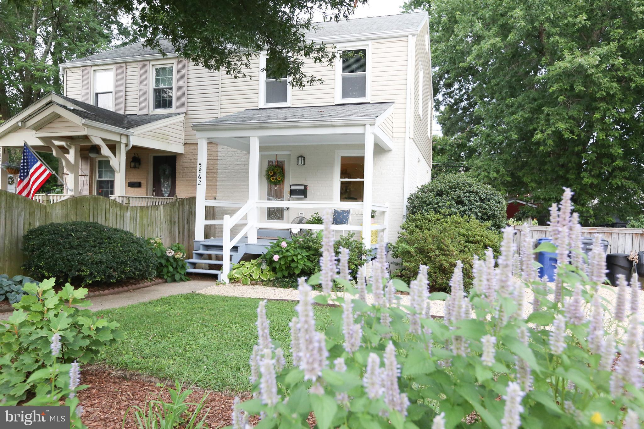 5862 Monticello Road Alexandria, VA 22303 - Photo 1 of 36 front view of a house with a yard