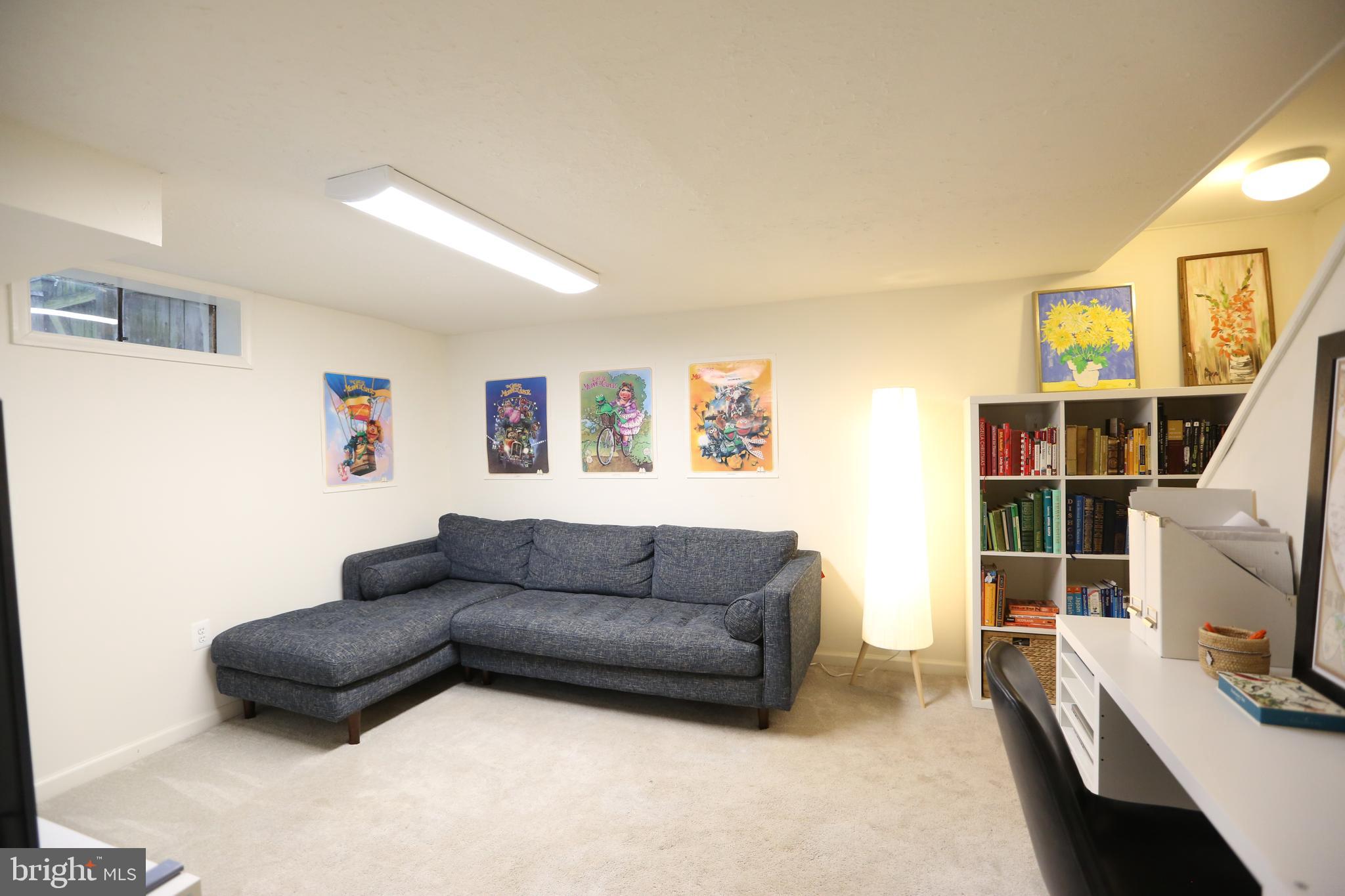 5862 Monticello Road Alexandria, VA 22303 - Photo 24 of 36 a living room with furniture and a flat screen tv