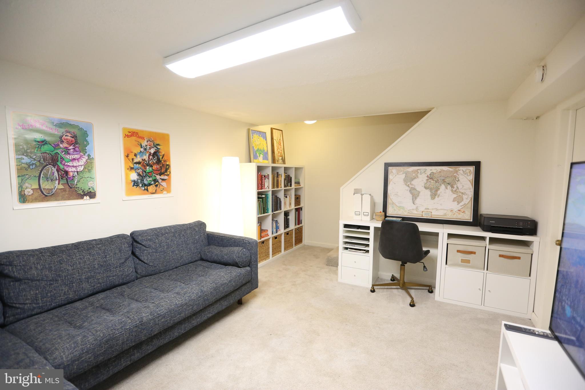 5862 Monticello Road Alexandria, VA 22303 - Photo 25 of 36 a living room with furniture and a flat screen tv