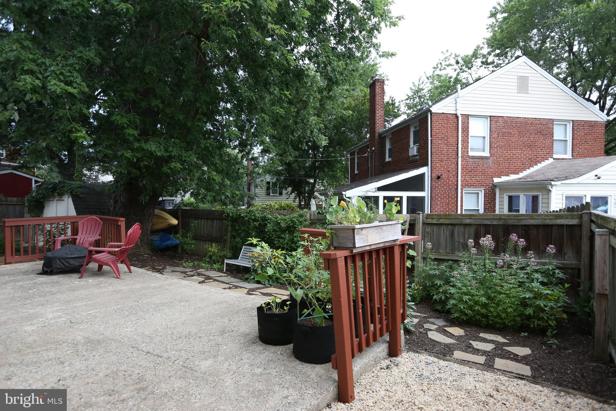 5862 Monticello Road Alexandria, VA 22303 - Photo 29 of 36 a view of a house with a backyard and sitting area