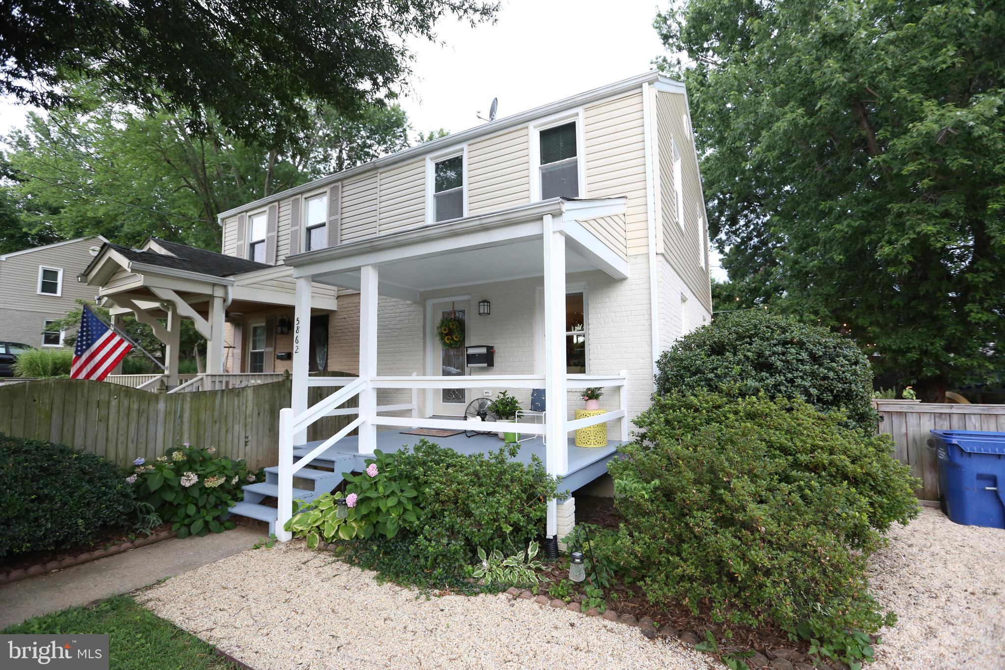 5862 Monticello Road Alexandria, VA 22303 - Photo 4 of 36 a front view of a house with garden