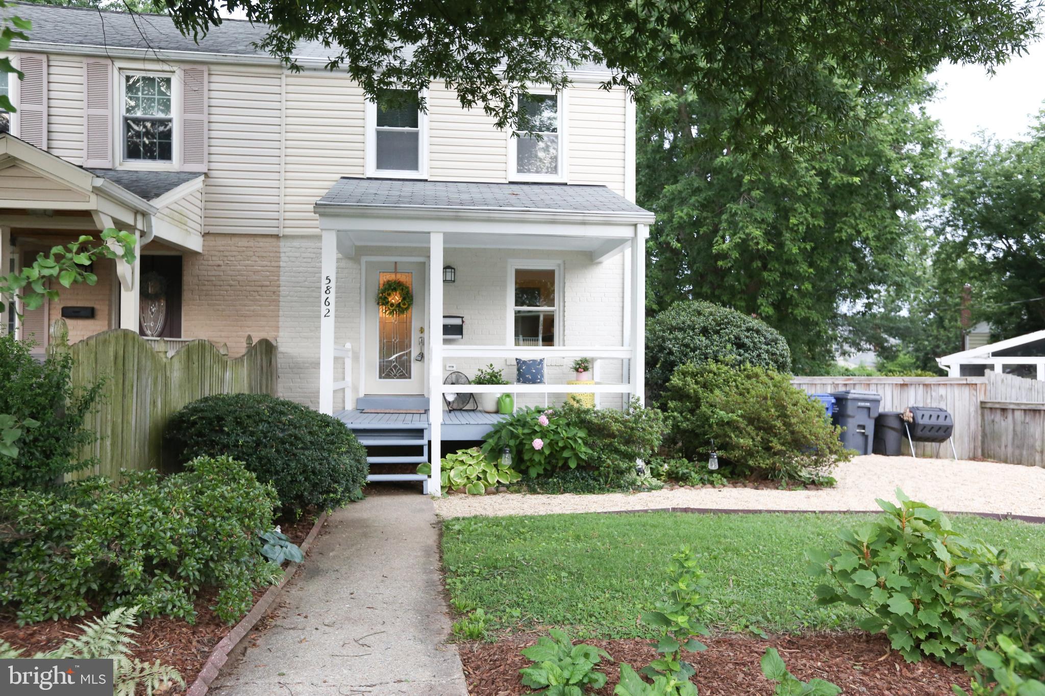 5862 Monticello Road Alexandria, VA 22303 - Photo 5 of 36 a front view of a house with a yard