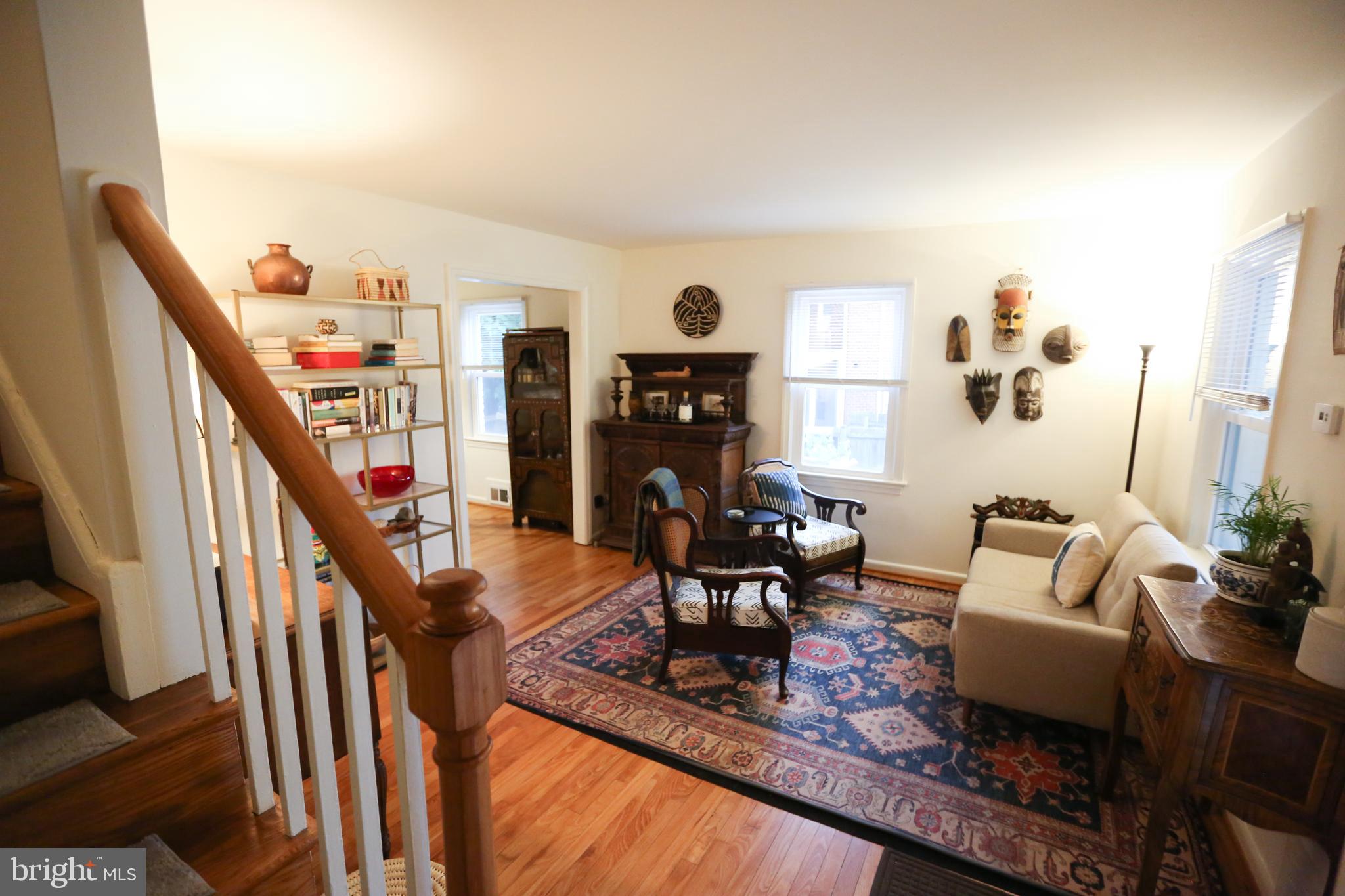 5862 Monticello Road Alexandria, VA 22303 - Photo 10 of 36 a living room with furniture and a fireplace