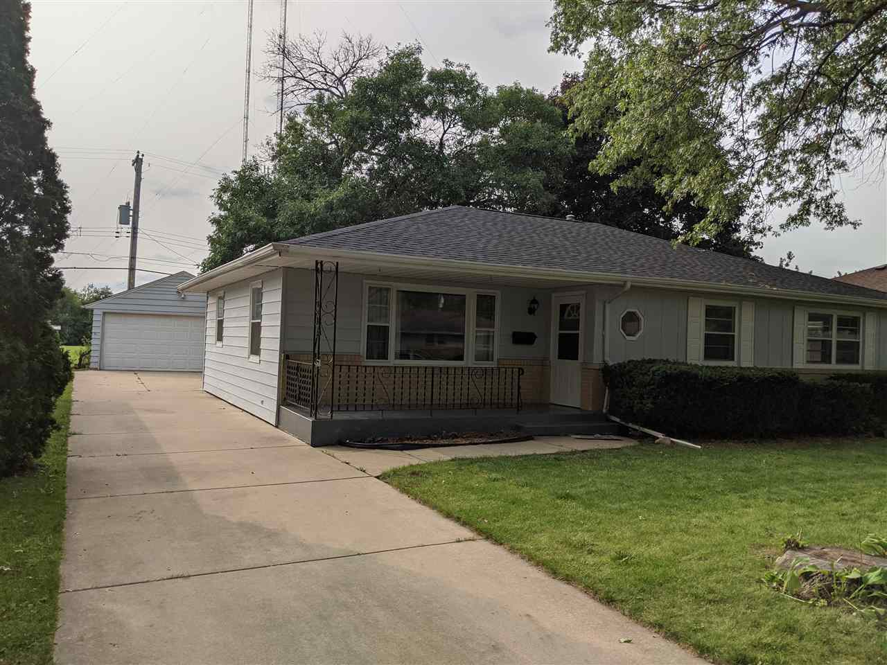 1024 Brookfield Road Rockford, IL 61107 - Photo 1 of 22 a front view of a house with a garden and yard