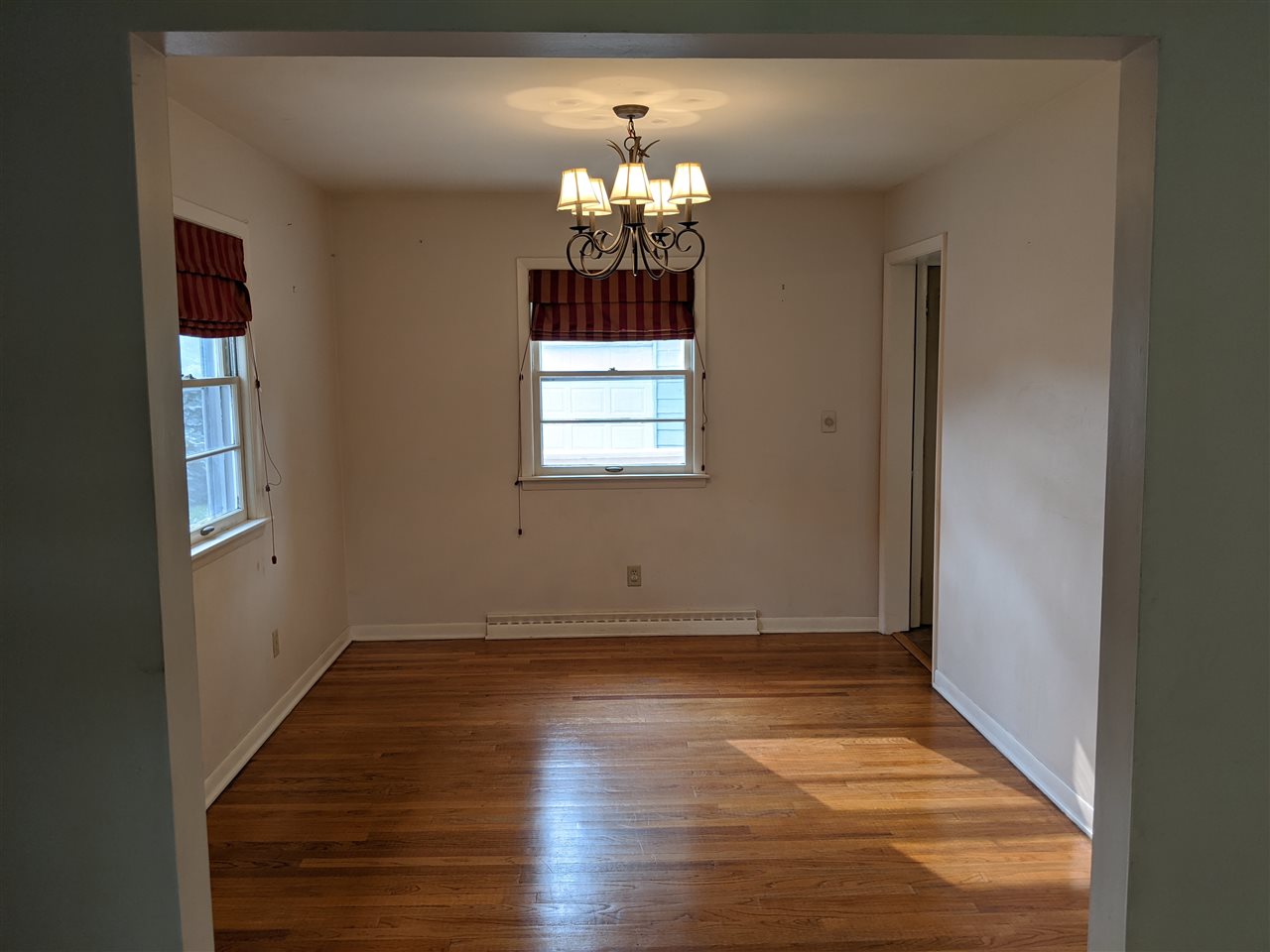 1024 Brookfield Road Rockford, IL 61107 - Photo 11 of 22 an empty room with window and wooden floor