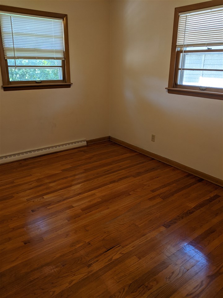 1024 Brookfield Road Rockford, IL 61107 - Photo 18 of 22 a view of a room with wooden floor and window