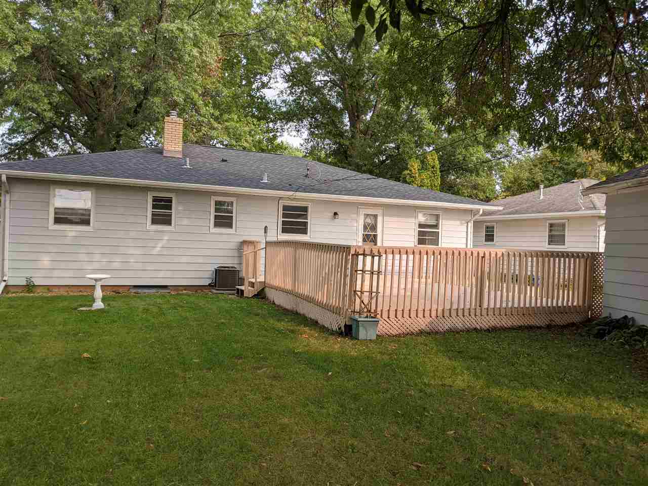 1024 Brookfield Road Rockford, IL 61107 - Photo 8 of 22 a view of a house with a yard and deck