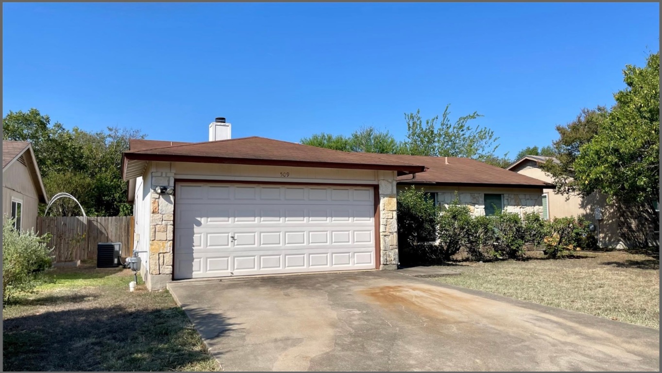 509 Riverwood Drive Cedar Park, TX 78613 - Photo 3 of 22 a front view of a house with a yard and garage