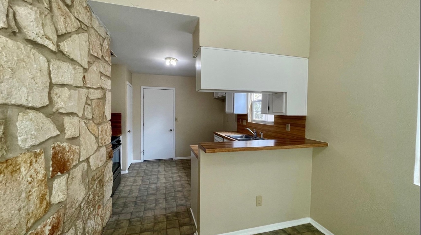 509 Riverwood Drive Cedar Park, TX 78613 - Photo 8 of 22 a view of a kitchen with a sink and cabinets