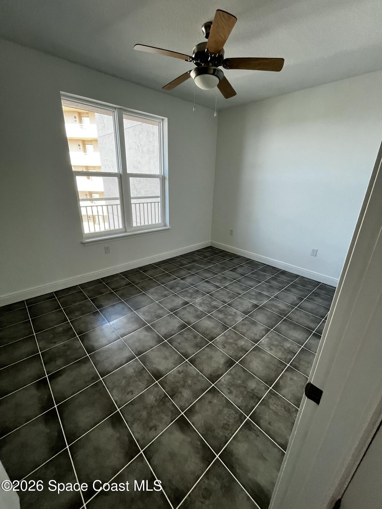 735 Pilot Lane, Unit 612 Merritt Island, FL 32952 - Photo 4 of 18 a view of an empty room and window