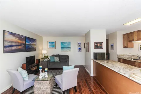 a living room with fireplace furniture and a flat screen tv