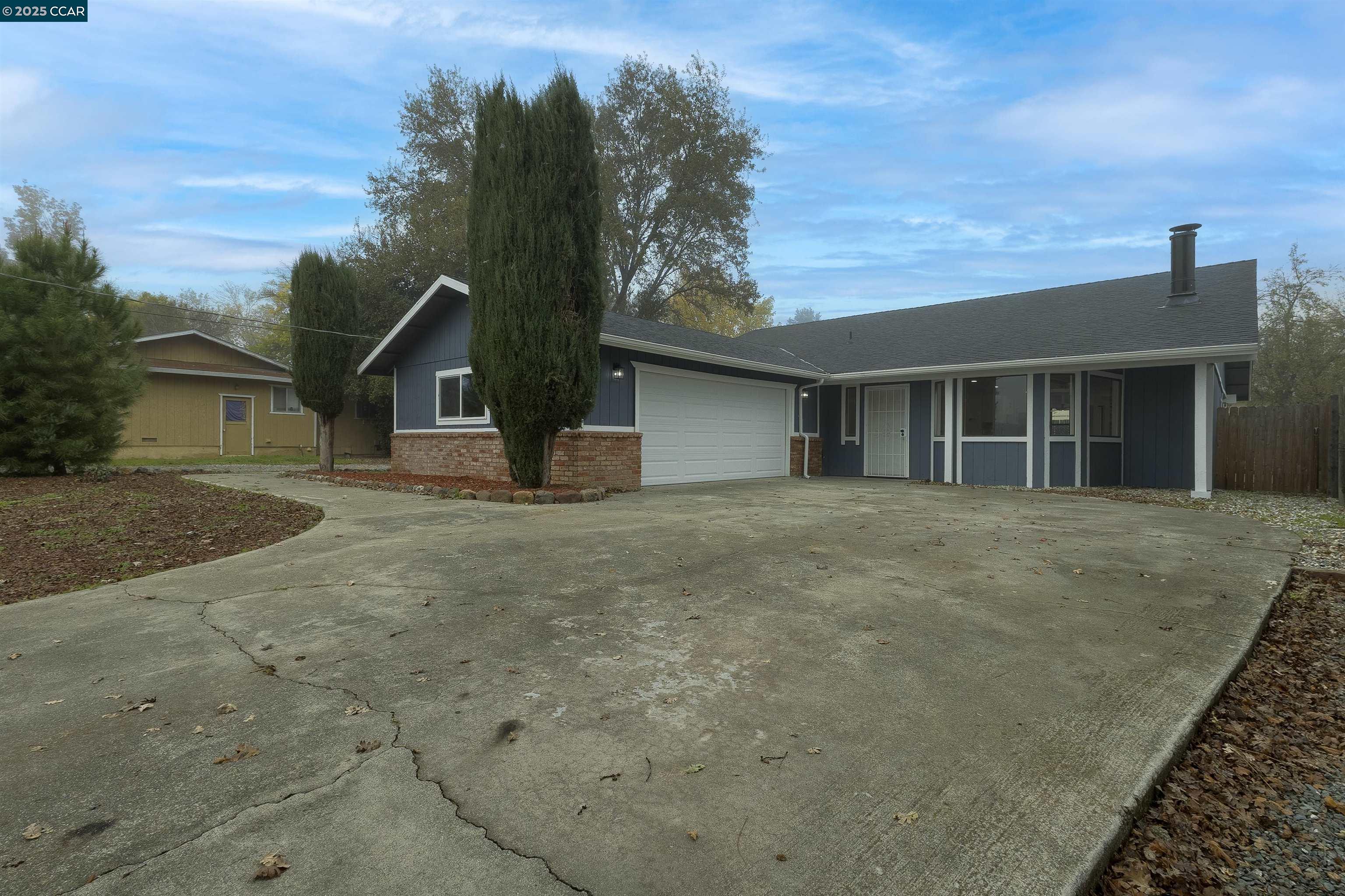 front view of a house with a dry yard