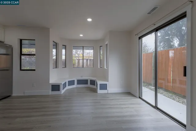 a bathroom with a shower sink vanity and mirror