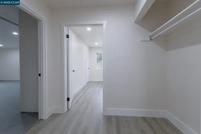 a view of room with window and hardwood floor