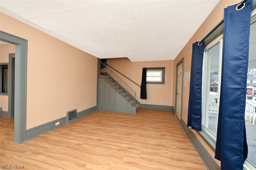 77 West Mildred Avenue Akron, OH 44310 - Photo 9 of 40 Foyer with light wood-style floors and a textured ceiling