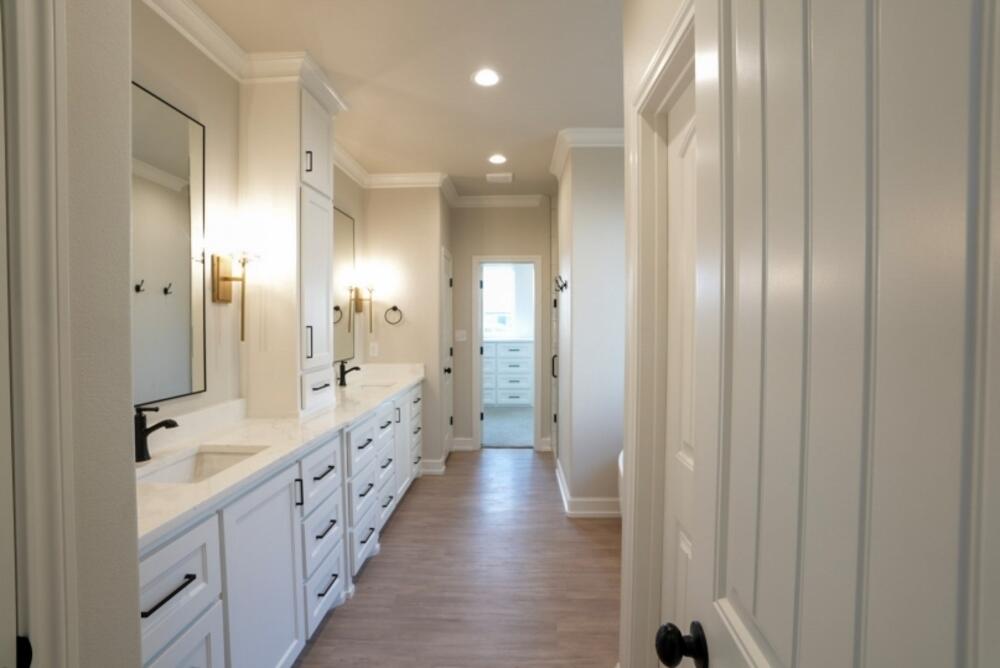7516 56th Street Lubbock, TX 79407 - Photo 19 of 31 a bathroom with double vanity and mirrors
