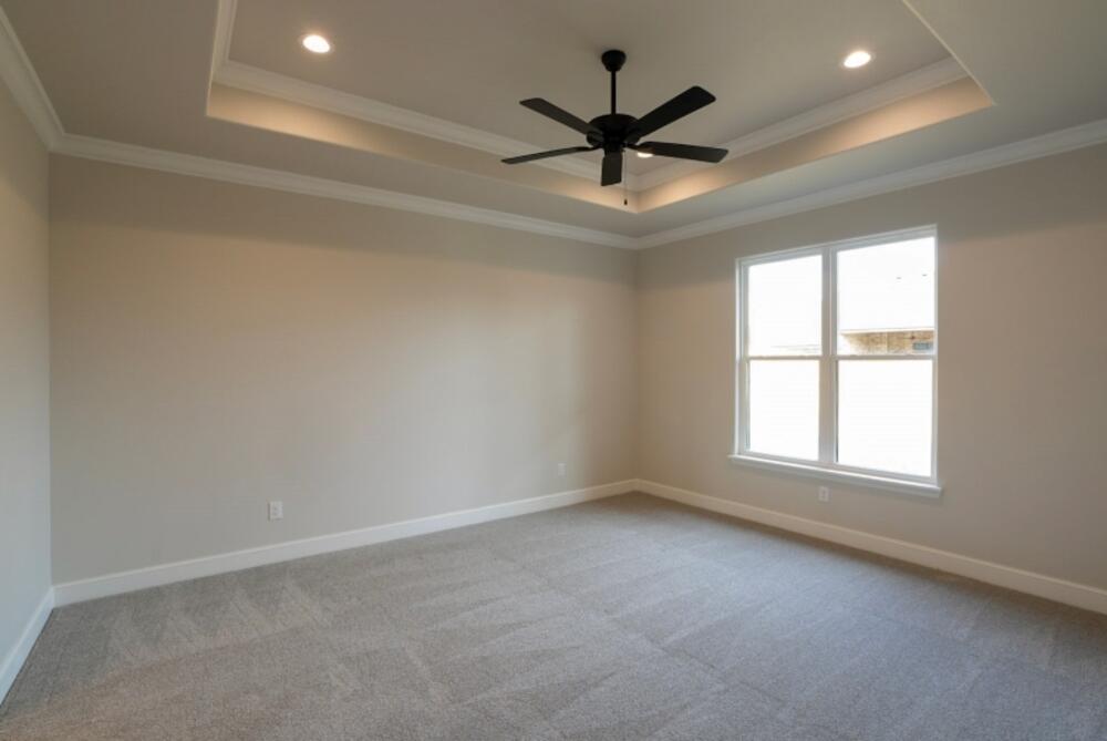 7516 56th Street Lubbock, TX 79407 - Photo 21 of 31 wooden floor in an empty room with a window