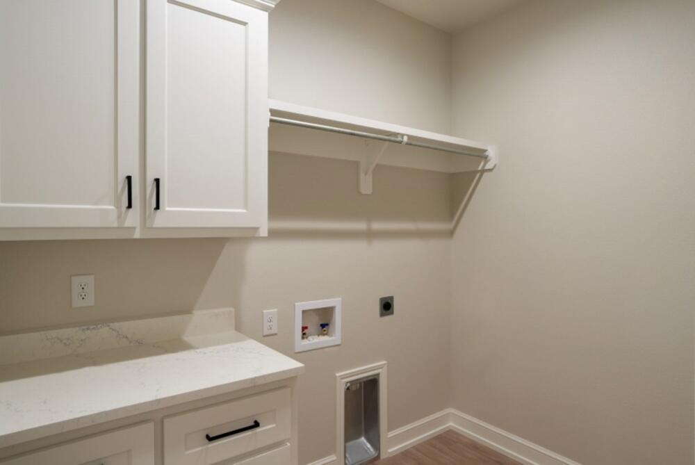 7516 56th Street Lubbock, TX 79407 - Photo 28 of 31 a view of storage and utility room with washer and dryer