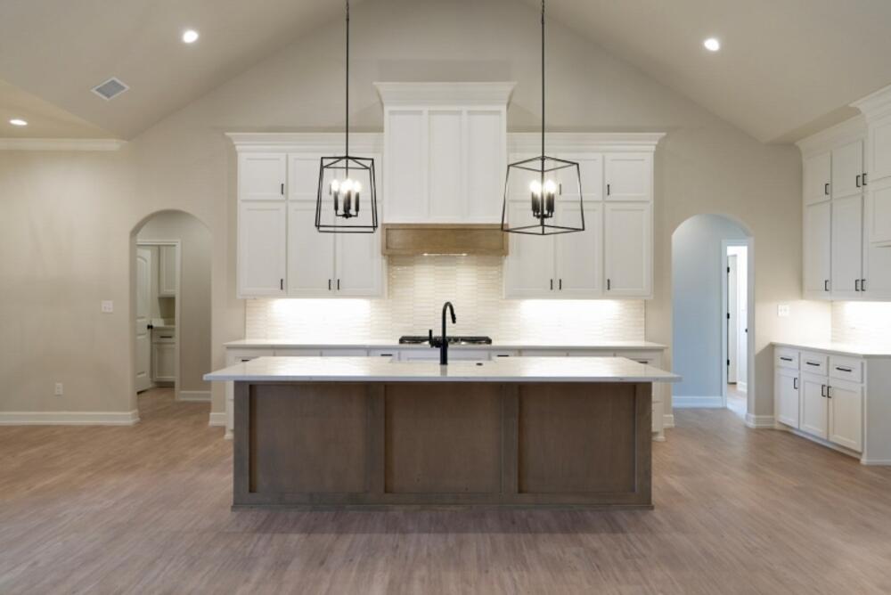 7516 56th Street Lubbock, TX 79407 - Photo 4 of 31 a kitchen with stainless steel appliances a sink and stove