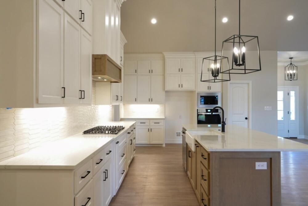 7516 56th Street Lubbock, TX 79407 - Photo 5 of 31 a kitchen with stainless steel appliances a sink stove and refrigerator