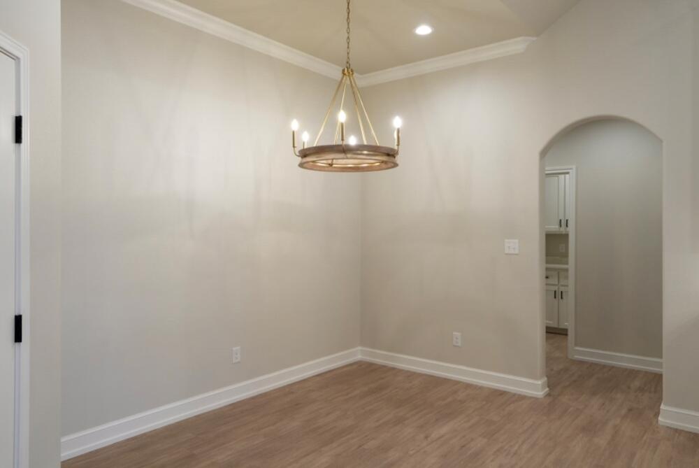 7516 56th Street Lubbock, TX 79407 - Photo 8 of 31 a view of a decorative light in a hallway
