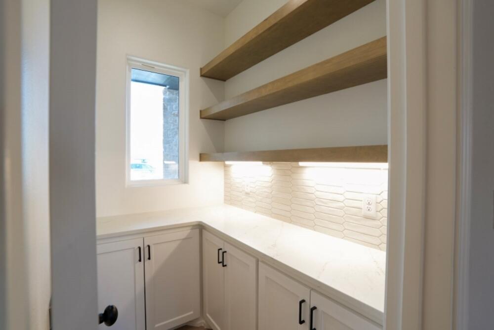 7516 56th Street Lubbock, TX 79407 - Photo 9 of 31 a view of a kitchen with a window