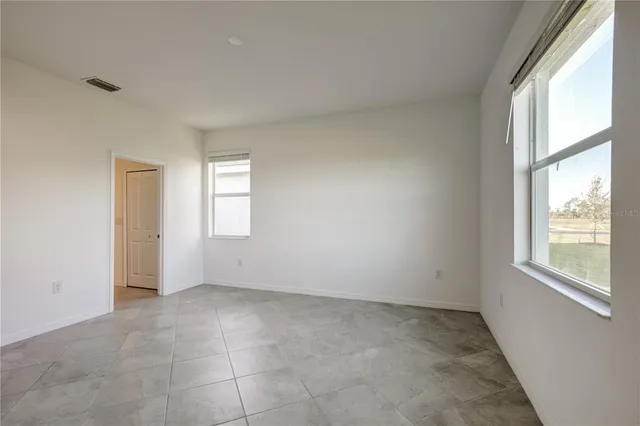 an empty room with windows