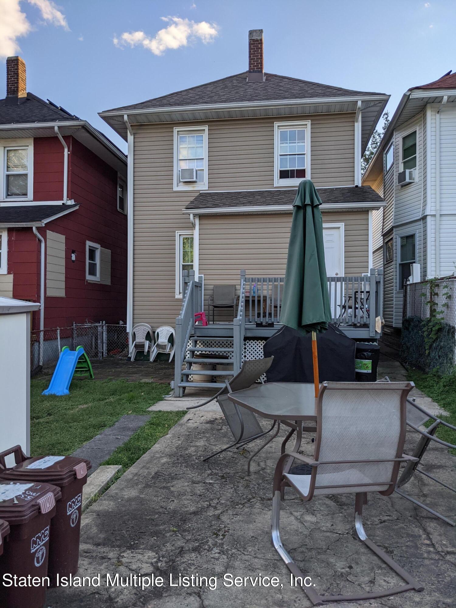 67 New Street Staten Island, NY 10302 - Photo 12 of 13 a view of a house with backyard