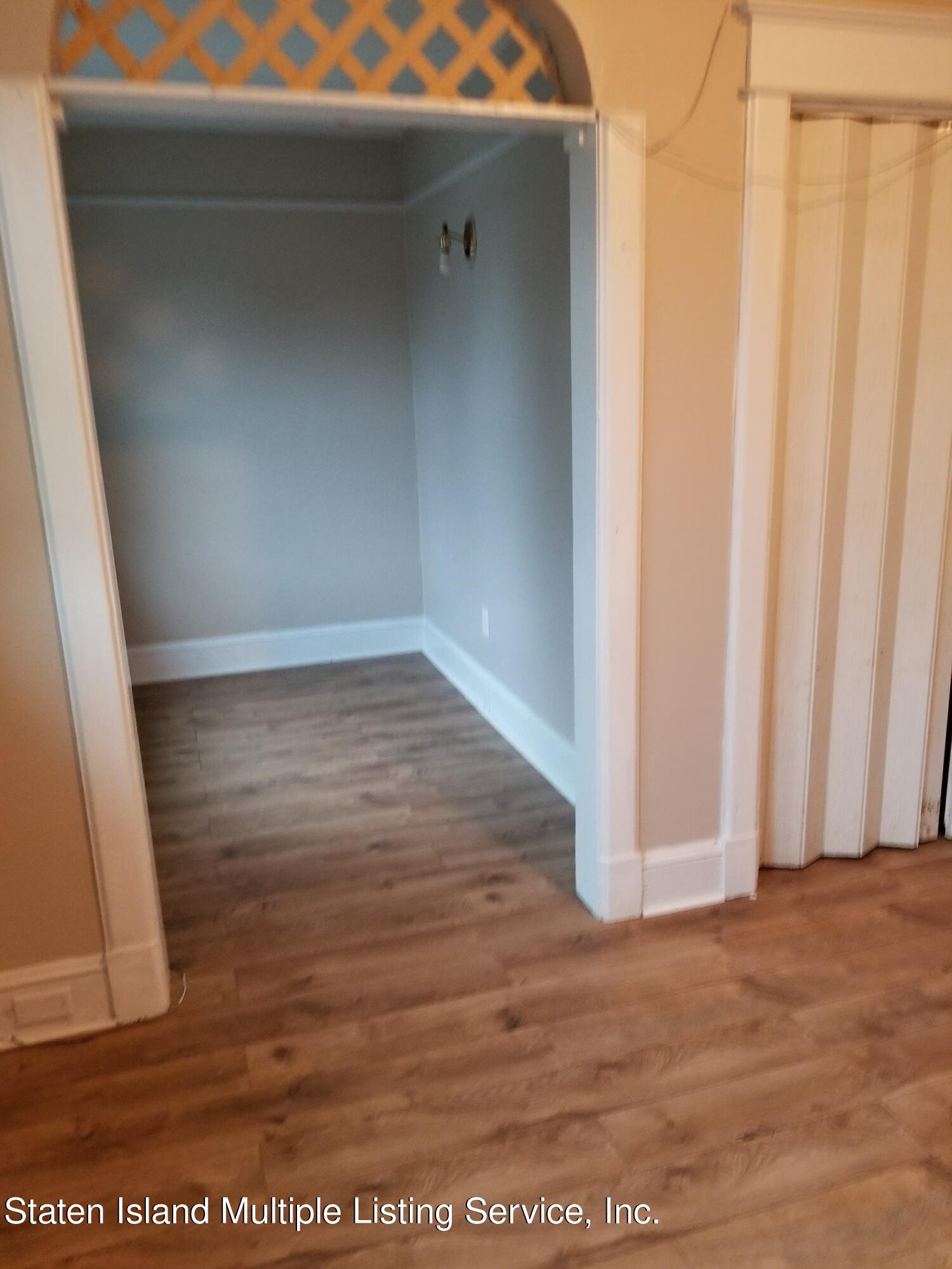 67 New Street Staten Island, NY 10302 - Photo 4 of 13 a view of wooden floor