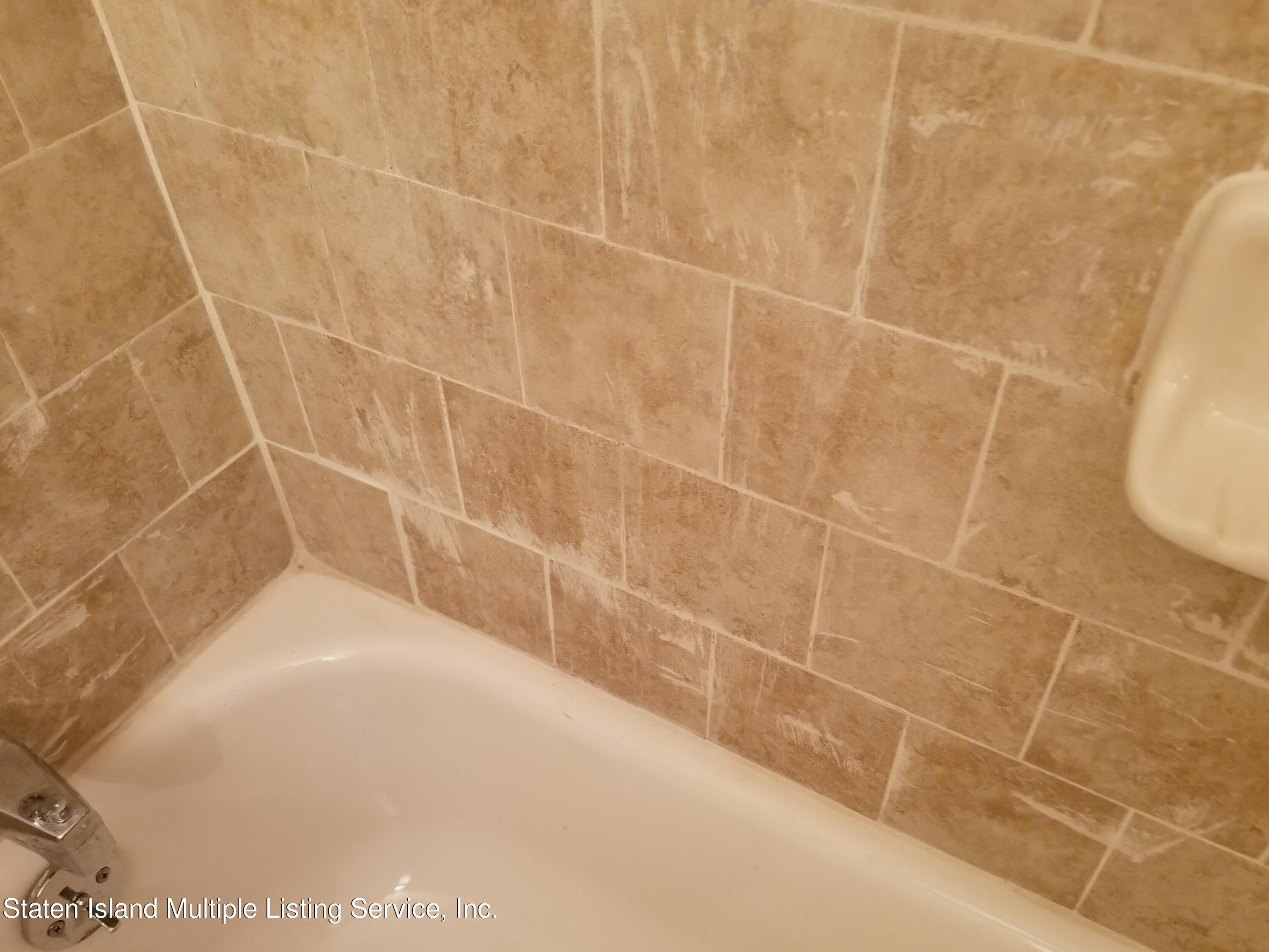 67 New Street Staten Island, NY 10302 - Photo 10 of 13 a bathroom with a shower