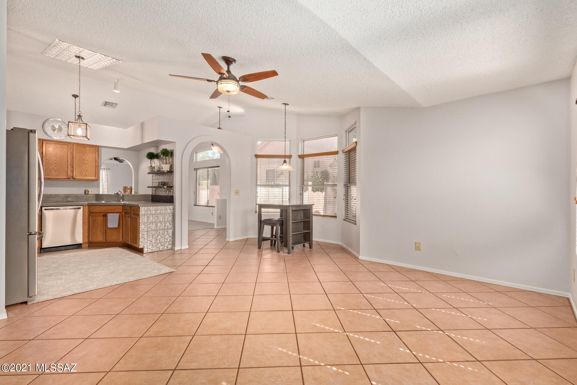 3034 West Sky Ranch Trail Tucson, AZ 85742 - Photo 6 of 27 a view of a kitchen with microwave and cabinets
